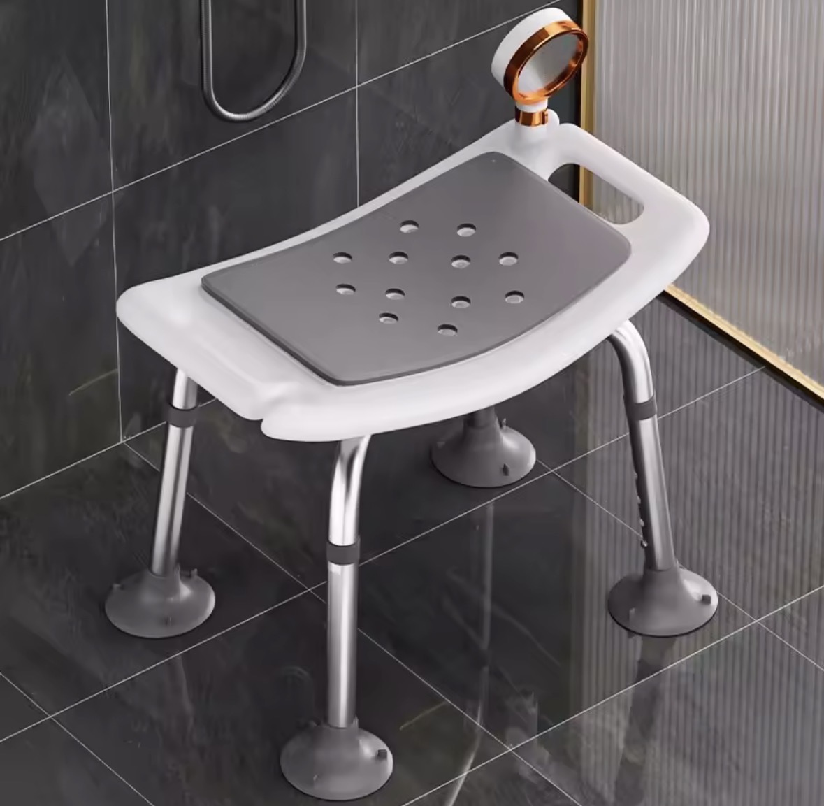 A shower stool with a backrest and suction feet, mounted in a shower